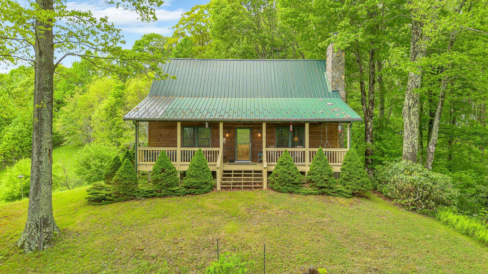 This home is nestled off the beaten path and embraced by mountain foilage.